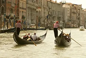 Riverfront Prints: Italy; Venice. Tourist ride in gondolas on the Grand Canal in Venice
