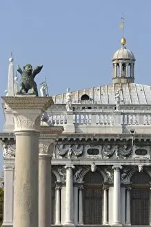 Images Dated 29th September 2004: Italy, Venice, winged lion statue and buildings along main dock area