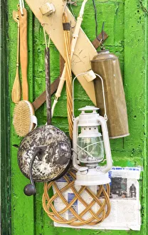 Images Dated 11th May 2019: Items for sale hanging on the door of a small storefront in old town Ostuni