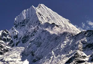 Sagarmatha Prints: The jagged peaks of Tamserku, at 21, 680 ft. jut into the blue skies of the Khumbu