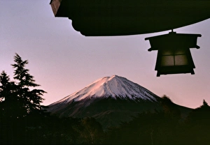 Fuji Hakone Izu Prints: Japan, Honshu, Yamanashi Pref. Fuji-Hakone-Izu NP. Sunrise brings a subtle glow to Mt