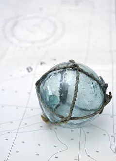 Japanese glass fishing float on nautical chart