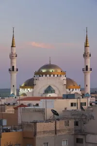 Madaba Prints: Jordan, Kings Highway, Madaba, elevated town view with mosque, dusk