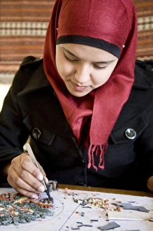 Madaba Prints: Jordan, Madaba. Mosaic artisan working with tesserae, small squares of local stone