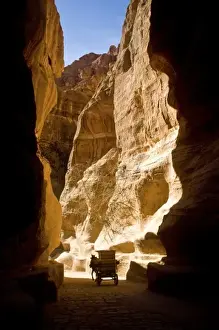Petra Prints: Jordan, Petra. A horse-drawn carriage in the Siq which leads to the fabled Hidden