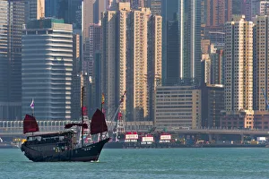 Cityscape Prints: Junk boat and high-rise in Victoria Bay, Hong Kong, China