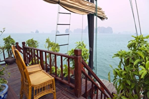 Junk boat and karst islands in Halong Bay, UNESCO World Heritage site