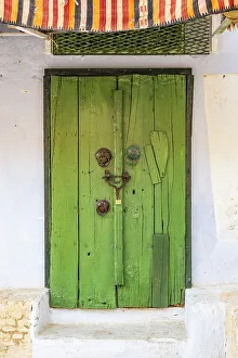 Tunisia Prints: Kairouan, Tunisia. A green door on a building in the city of Kairouan