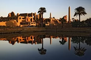 Images Dated 22nd November 2005: Karnak Temple and the Sacred Lake at sunrise. Karnak was the residence of gods, Amon-Re