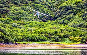 Images Dated 3rd June 2024: Katmai National Park and Preserve, Alaska. Landscape view of float plane landing in a cove