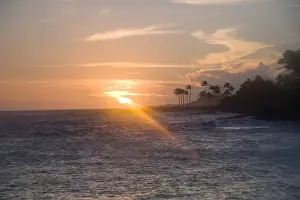 Images Dated 29th March 2008: Kauai, Hawaii. A late afternoon sunset overlooking the rocky volcanic rocks and ocean