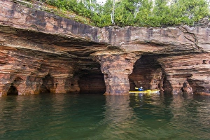 Images Dated 18th September 2010: Kayaker exploring the sea caves of Devils Island in the Apostle Islands National Lakeshore