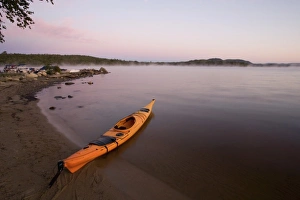 Jerry Marcy Monkman Prints: A kayaker on the shore of Umbagog Lake in Errol, NH. Umbagog Lake State Park