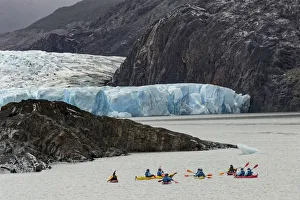 Prints of Kayakers exploring Grey Lake and Grey Glacier, Torres del Paine National Park, Chile, South America.Patagonia, Patagonia Images Dated 2016 December: Kayakers exploring Grey Lake and Grey Glacier, Torres del Paine National Park