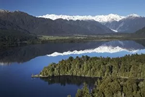 Images Dated 8th July 2007: Kayakers, Lake Mapourika, and Southern Alps, West Coast, South Island, New Zealand
