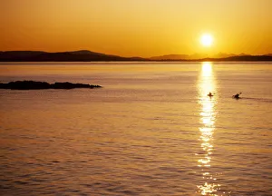 Kayak Prints: Kayakers at sunset, San Juan Island, Washington State, USA