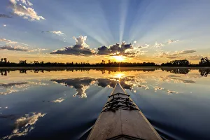 Kayak Prints: Kayaking into sunset rays on McWennger Slough near Kalispell, Montana, USA