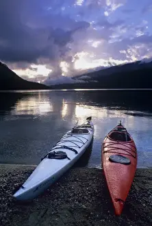 Sea Kayak Prints: Kayaks at sunset on Rainbow Falls Beach on Azure Lake in Wells Gray Provincial Park