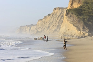 Environmentalism Prints: Kids playing on beach. Santa Cruz coast, California, US. Hazy day at the Beach