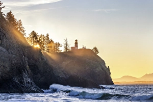 Images Dated 3rd December 2023: King tide waves crash into the cliffs below Lighthouse at Cape Disappointment State Park in Washington State