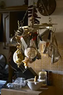 Spoon Prints: Kitchen utensils hanging on hooks in the Provence kitchen: raper, stainer, sieves