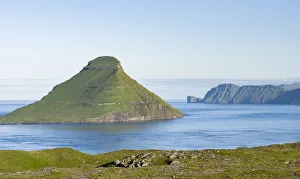 Images Dated 9th July 2016: Koltur island at sunrise, the island Vagar in the background The island Streymoy