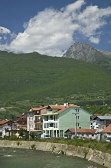 KOSOVO, Pec. Riverside view of the city of Pec along the Montenegrin frontier