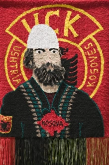 Images Dated 12th May 2007: Kosovo, Pec. Roadside Souvenir stall selling rugs with UCK (Ushtria Clirimtare e