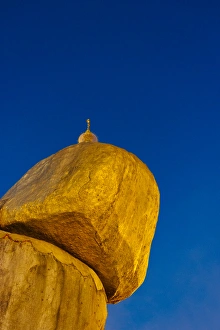 Images Dated 21st March 2015: Kyaiktiyo Pagoda (Gold Rock) at sunset, a small pagoda built on the top of a granite