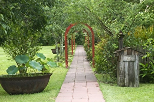 Pathway Prints: LA, Vacherie, Laura Plantation, Walkway with sugar kettle on the sugarcane plantation