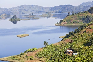 East Africa Prints: Lake Mutanda near Kisoro in Uganda. On the shoreline the land is cultivated, very