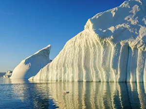 Landscape with icebergs in the Sermilik (Sermiligaaq) Icefjord in East Greenland. Ammassalik, Danish Territory