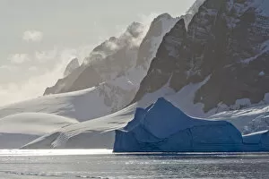 Antarctica Gallery: Landscape of snow covered island with iceberg in South Atlantic Ocean, Antarctica