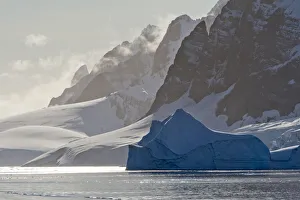 Iceberg Prints: Landscape of snow covered island with iceberg in South Atlantic Ocean, Antarctica