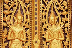 Laos, Luang Prabang. Golden relief carvings