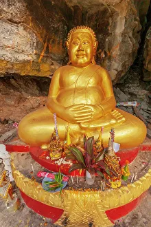 Laos, Luang Prabang. Vat Thammo Thayaram on Mount Phousi. Fat Buddha statue