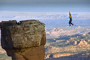 Danger Prints: Larry Harpe highlining (slacklining) between Navaho Sandstone Towers on BLM land near Moab