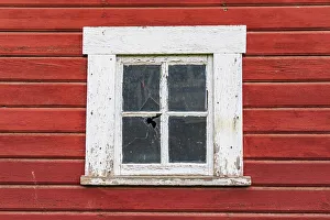 Latah, Washington State, USA. White framed window in a red barn