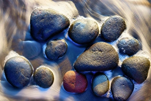 Bali Prints: Lava beach rocks worn by centuries of sea water cover the black sand beaches of Bali
