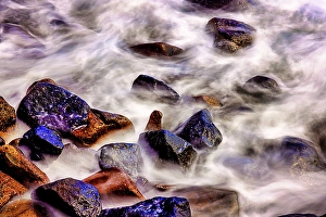 Bali Prints: Lava beach rocks worn by centuries of sea water cover the black sand beaches of Bali