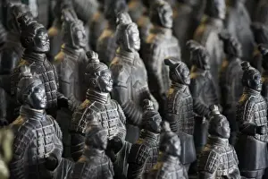 Imperial Prints: Life-size Imperial terra cotta warriors in battle formation stretch over the length