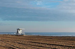 Tire Track Prints: A Lifeguard shack on almost deserted Huntington Beach, on the Pacific Ocean, California