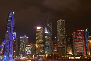 Prints of Light show on skyscrapers, and Hong Kong Observation Wheel, Central, Hong Kong Island, Hong Kong, China Images Dated 2018 June: Light show on skyscrapers, and Hong Kong Observation Wheel, Central, Hong Kong Island