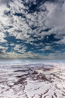 Prints of A light snowfall and contrasting orange-colored terrain define the rugged landscape of Canyonlands National Park Images Dated 2024 November: A light snowfall and contrasting orange-colored terrain define the rugged landscape of Canyonlands National Park