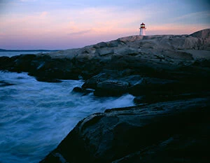 The lighthouse at Peggys Cove on the southern coast of Nova Scotia, Canada with waves