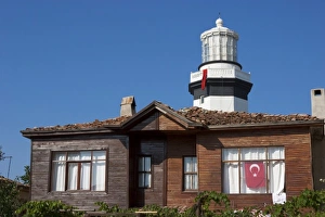 Head Land Prints: Lighthouse of Sile as seen behind an old wooden house, Istanbul, Turkey