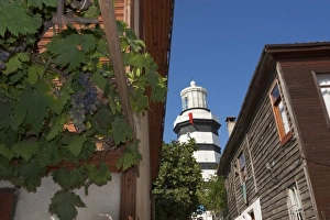 Head Land Prints: Lighthouse of Sile as seen behind old wooden houses, Istanbul, Turkey