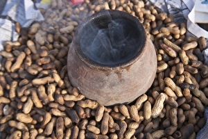 Pushkar Prints: Lighting incense to drive away flies, Pushkar, Rajasthan, India
