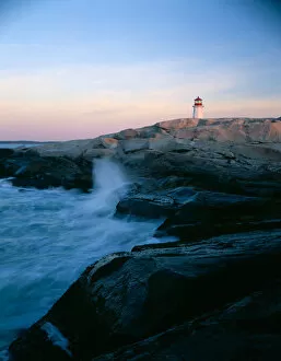 The lightouse at Peggys Cove along the granite shoreline of southern Nova Scotia, Canada