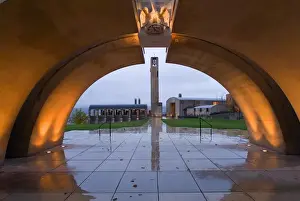 Kelona Prints: Lights throw golden light on the concrete arched entrance to Mission Hill Family